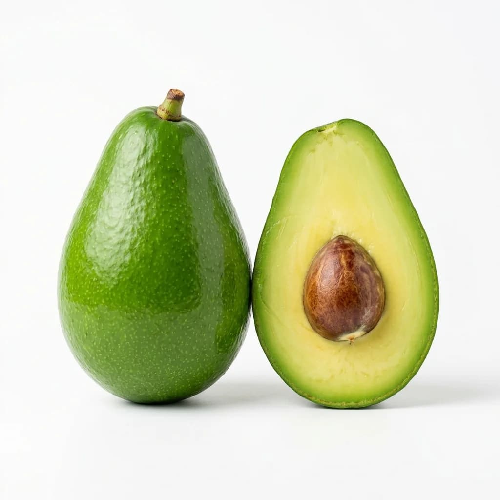 A whole Fuerte avocado with smooth green skin beside a halved fruit showing the stone